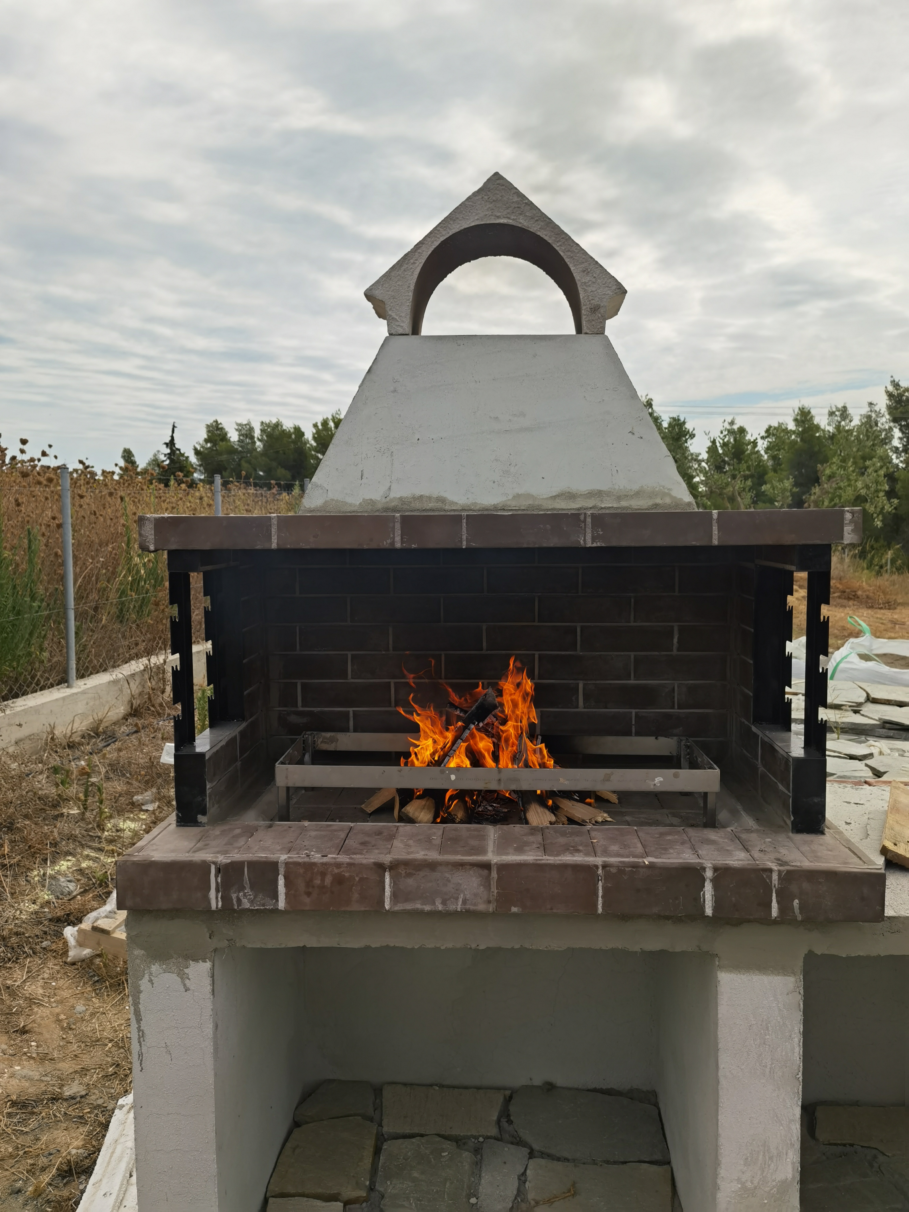 a fire pit with a large round dome and a large round metal dome
