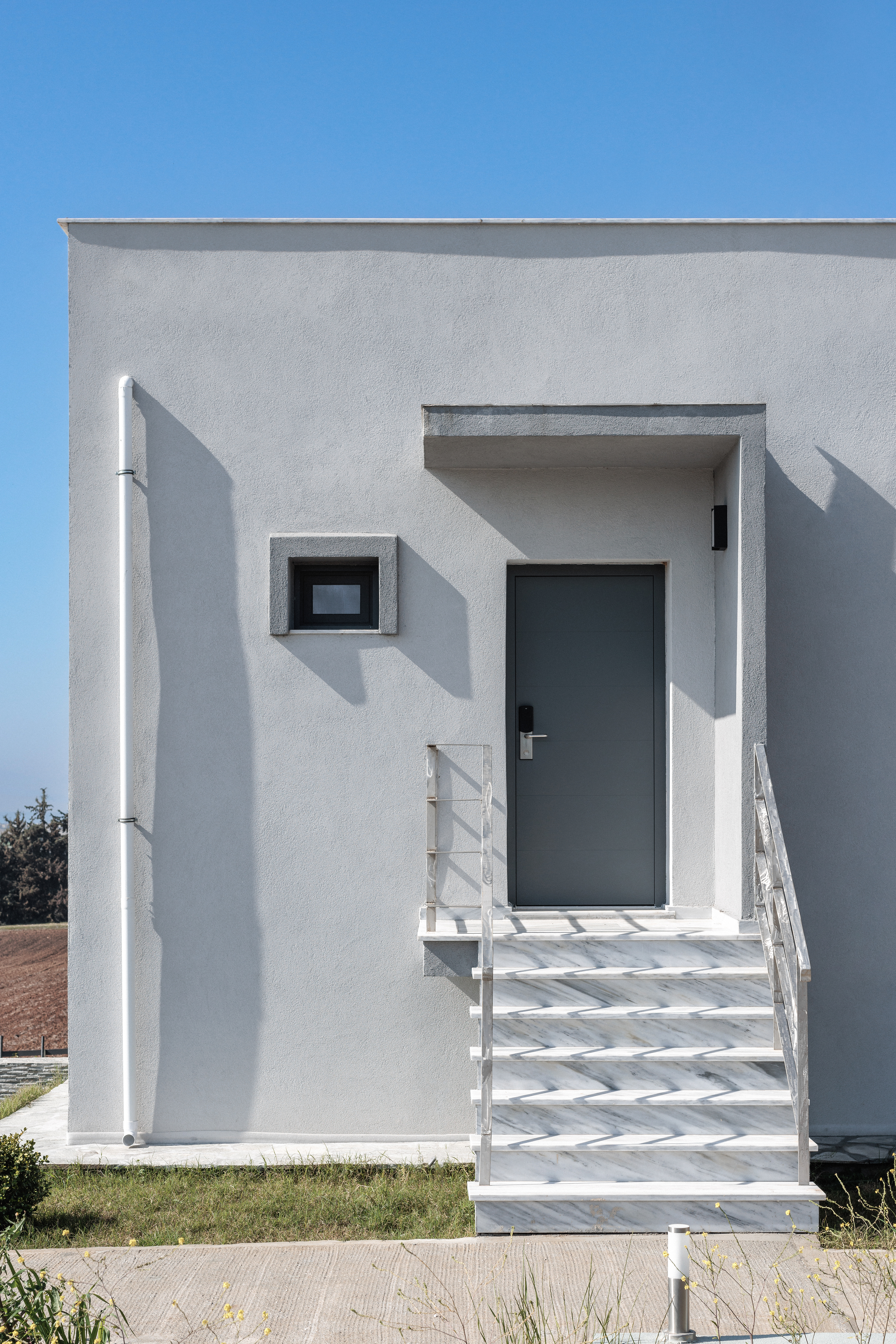 a white building with a staircase