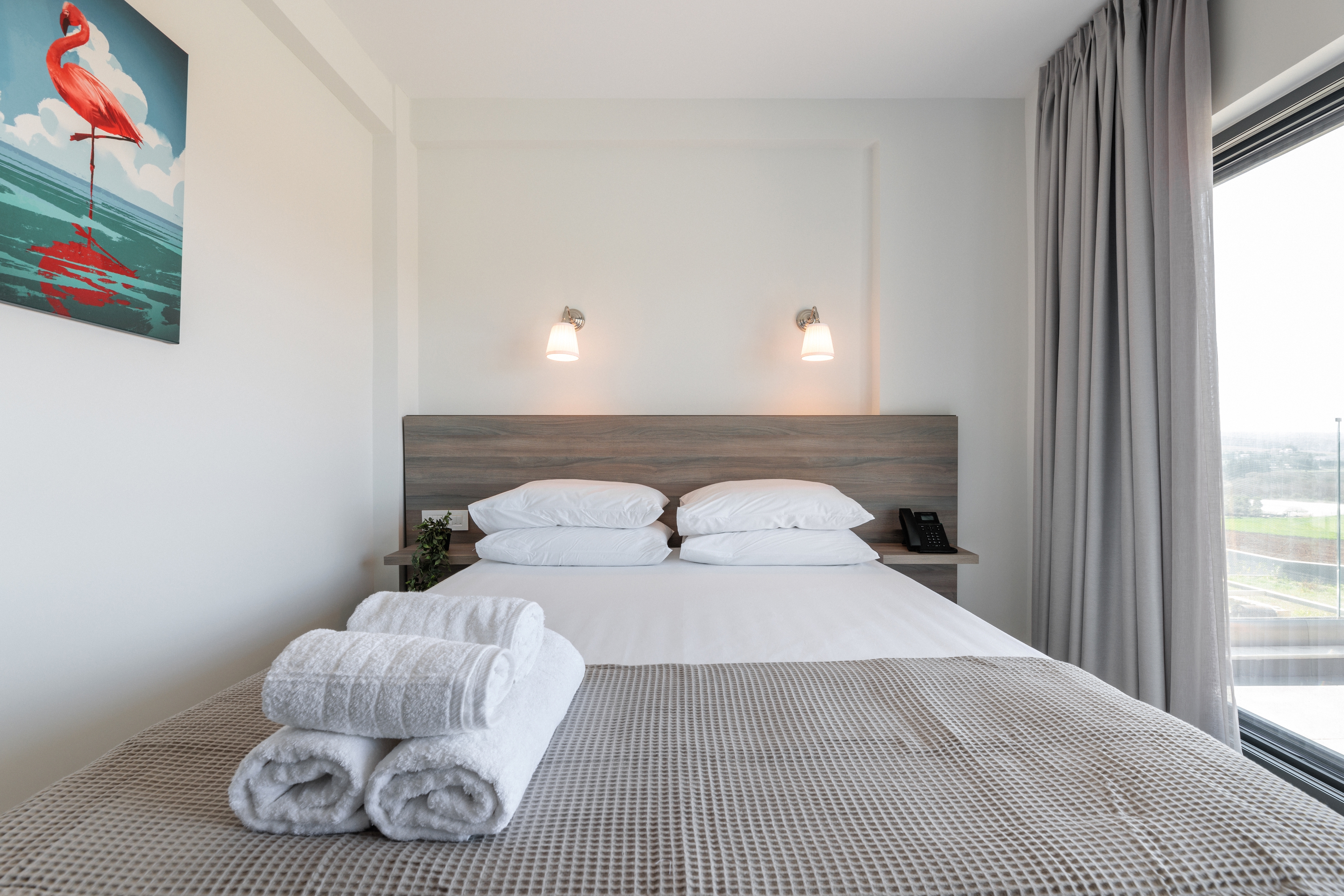 a bedroom with a large window