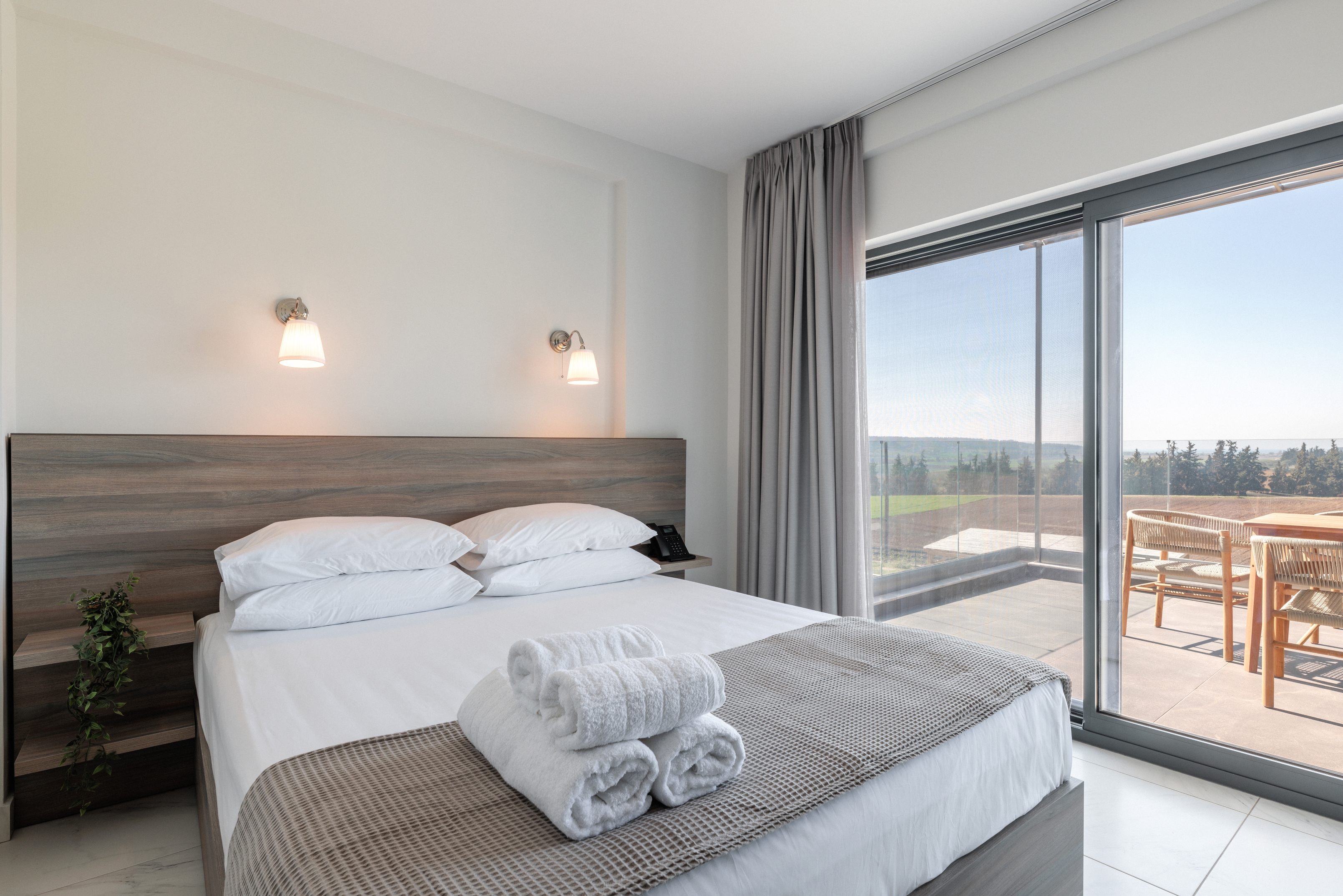 a bedroom with a large window