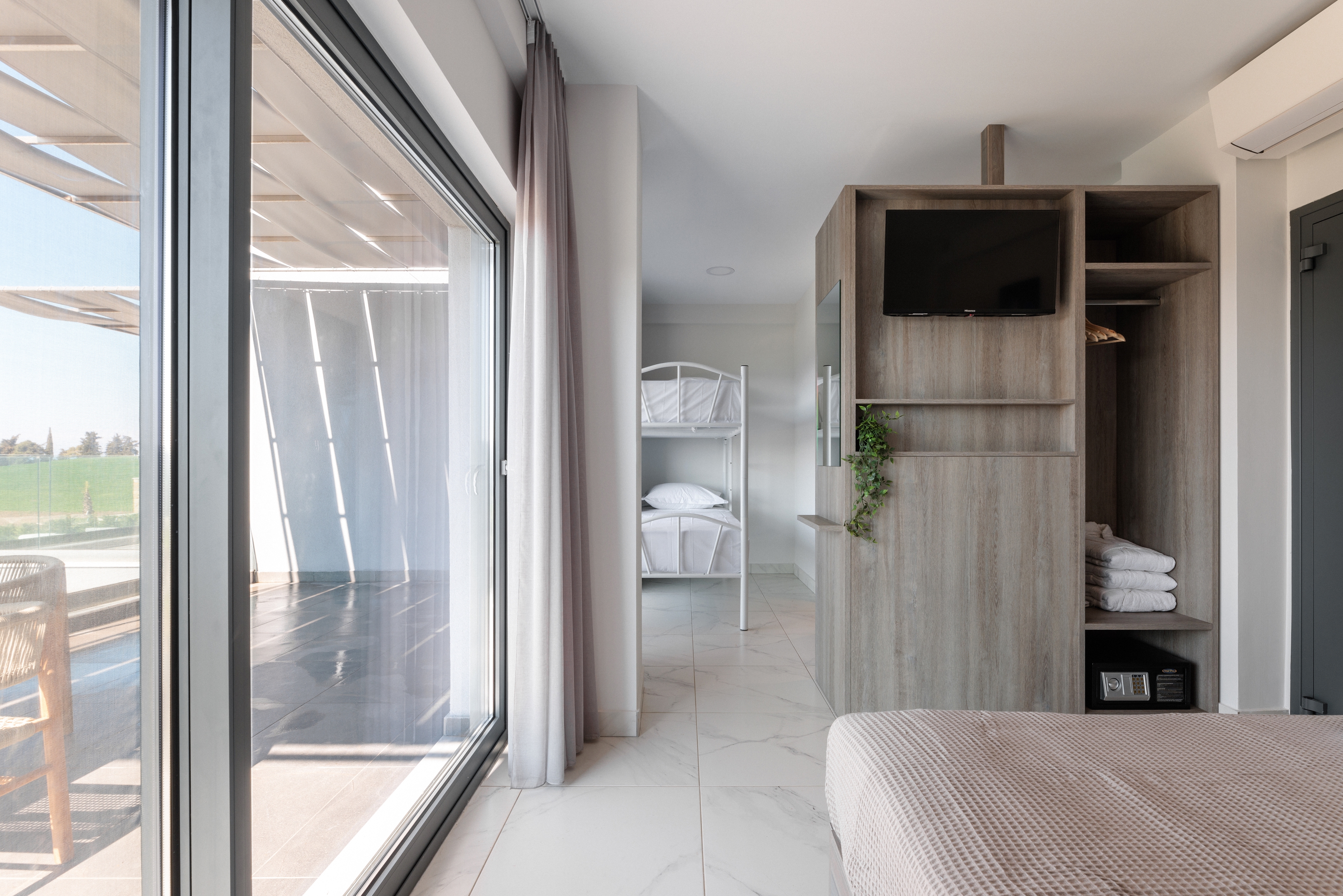a room with a bed and a tv