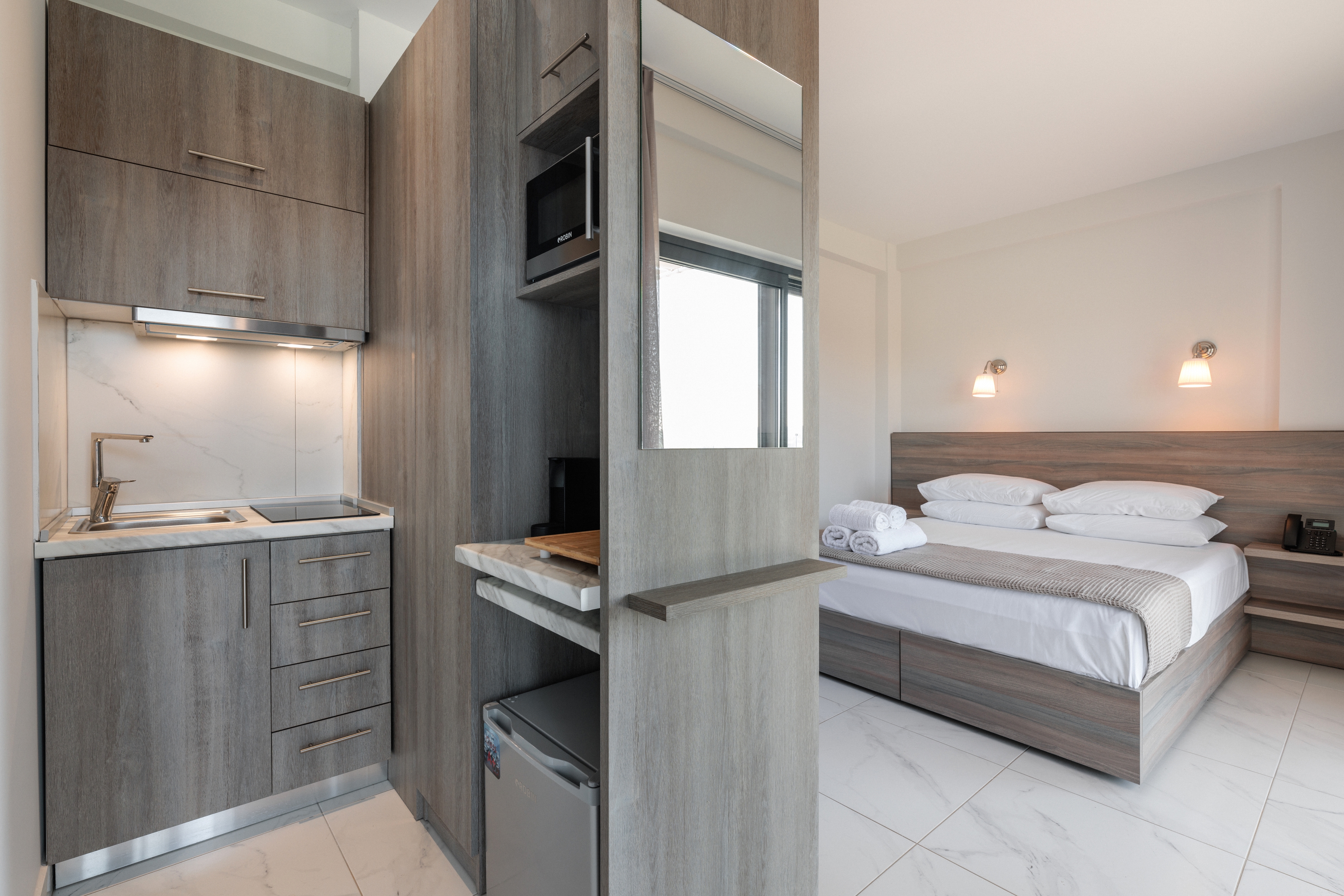 a bathroom with a bed and a sink