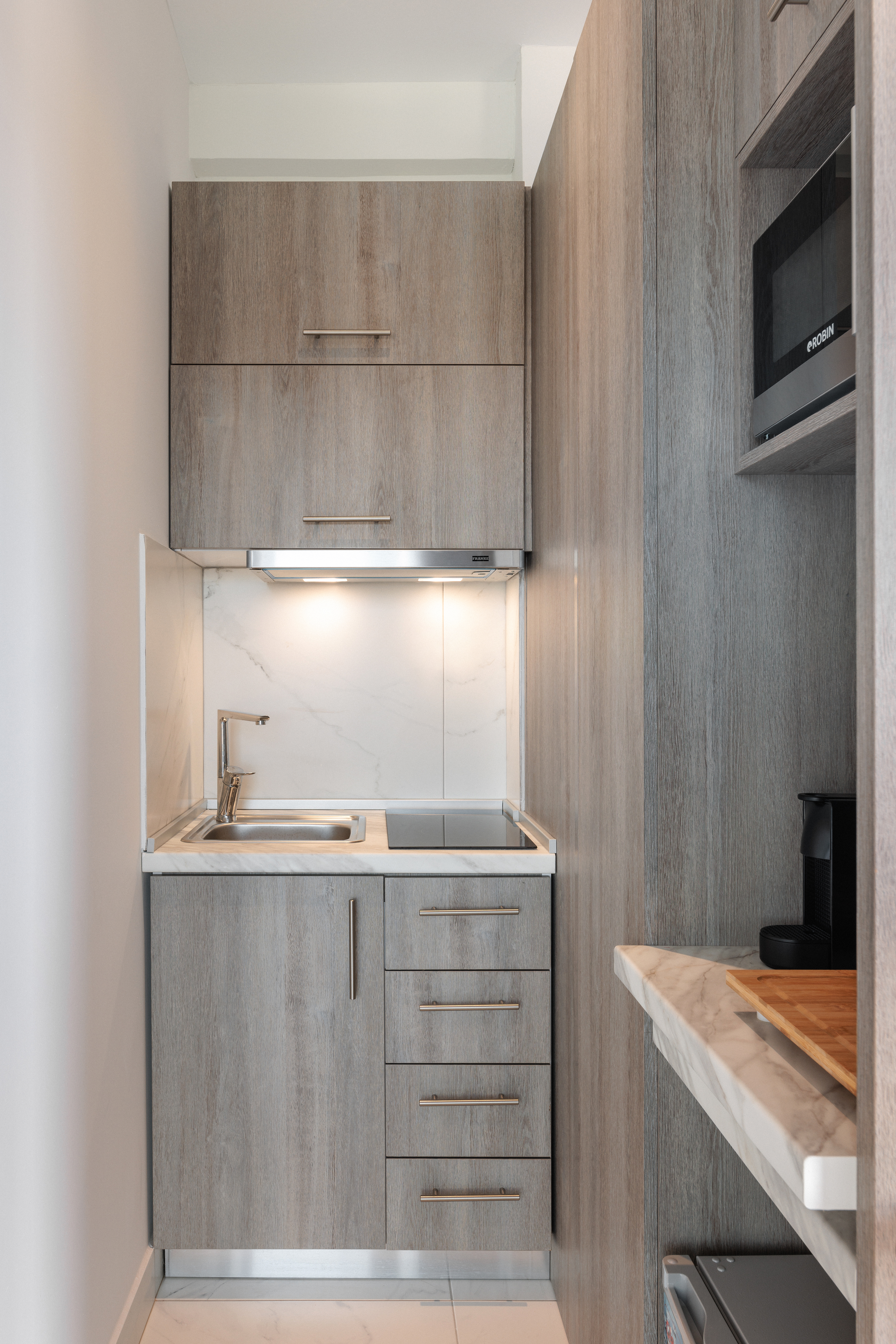 a kitchen with a sink and cabinets