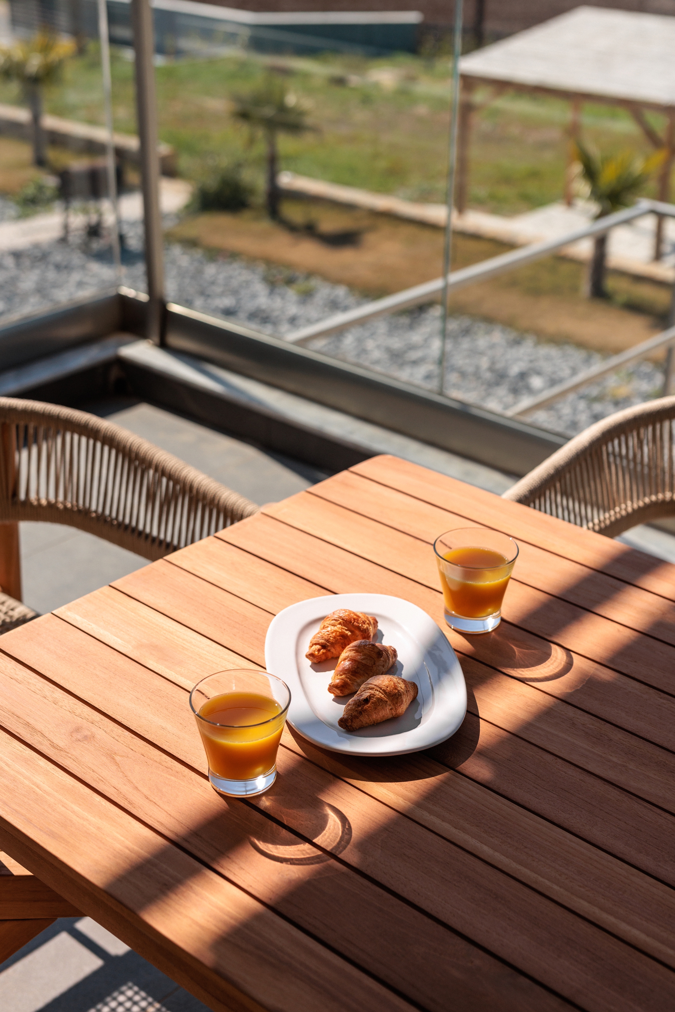a plate of food and a glass of beer on a table