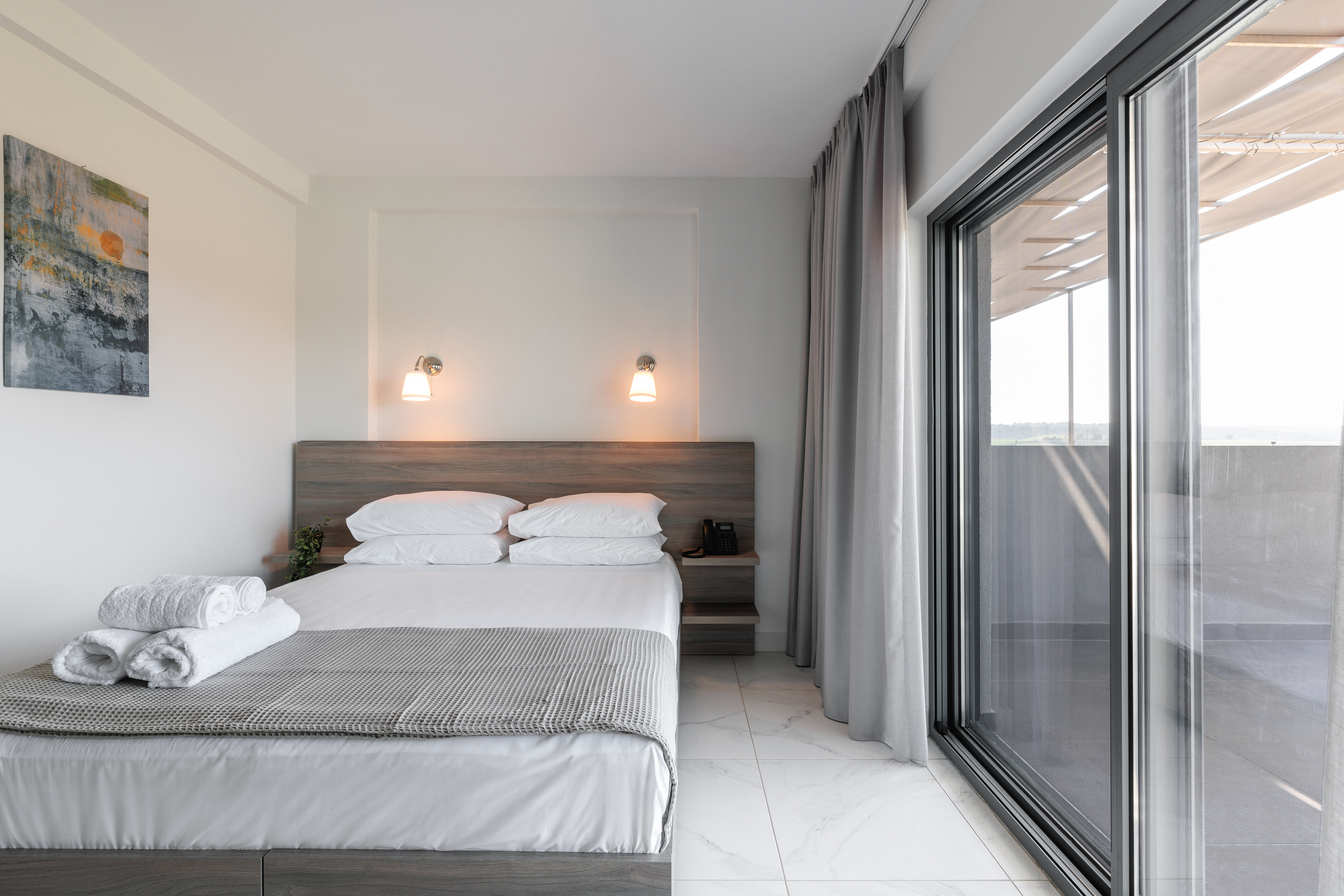 a hotel room with a glass door