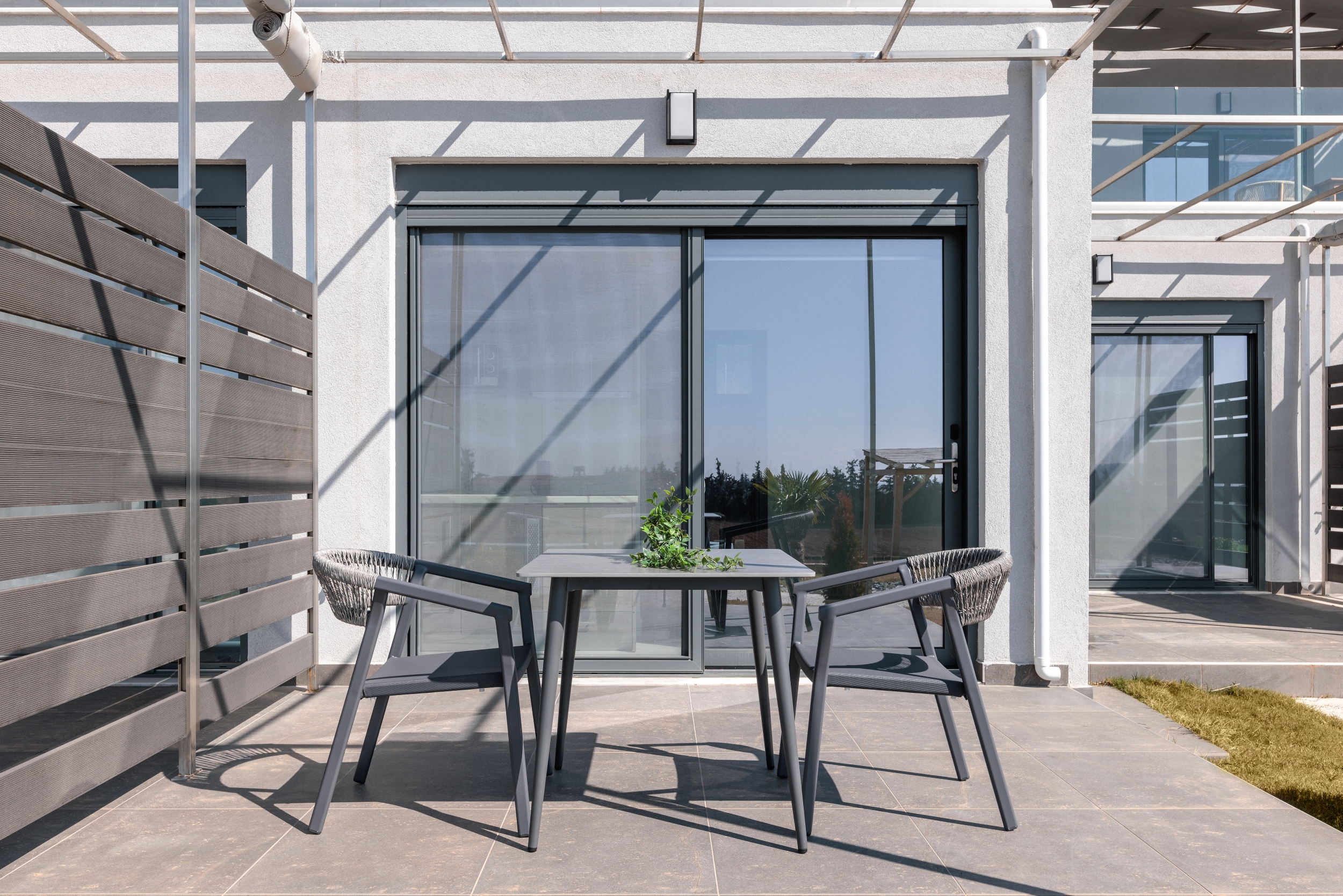 a table and chairs outside a building
