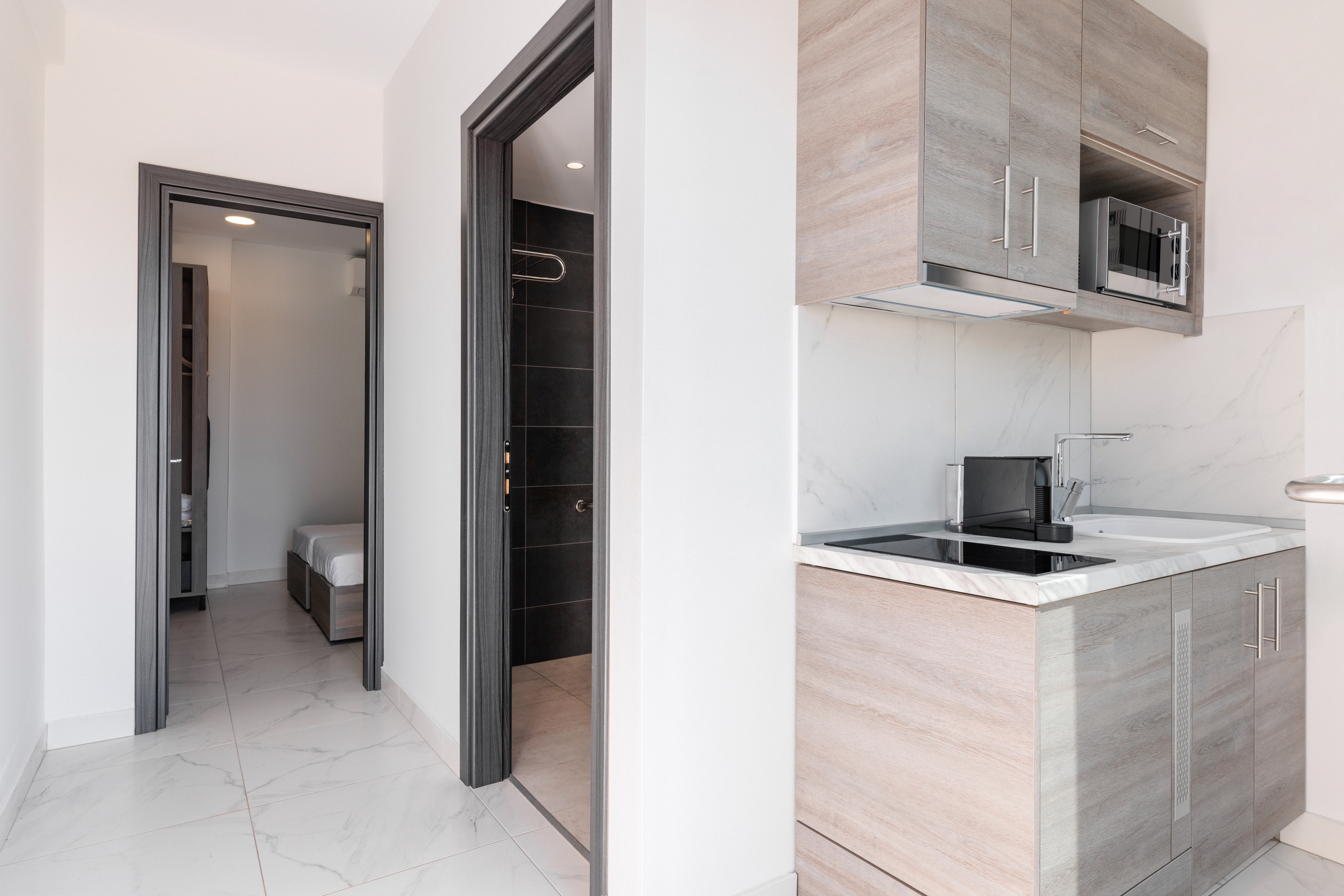a kitchen with white cabinets
