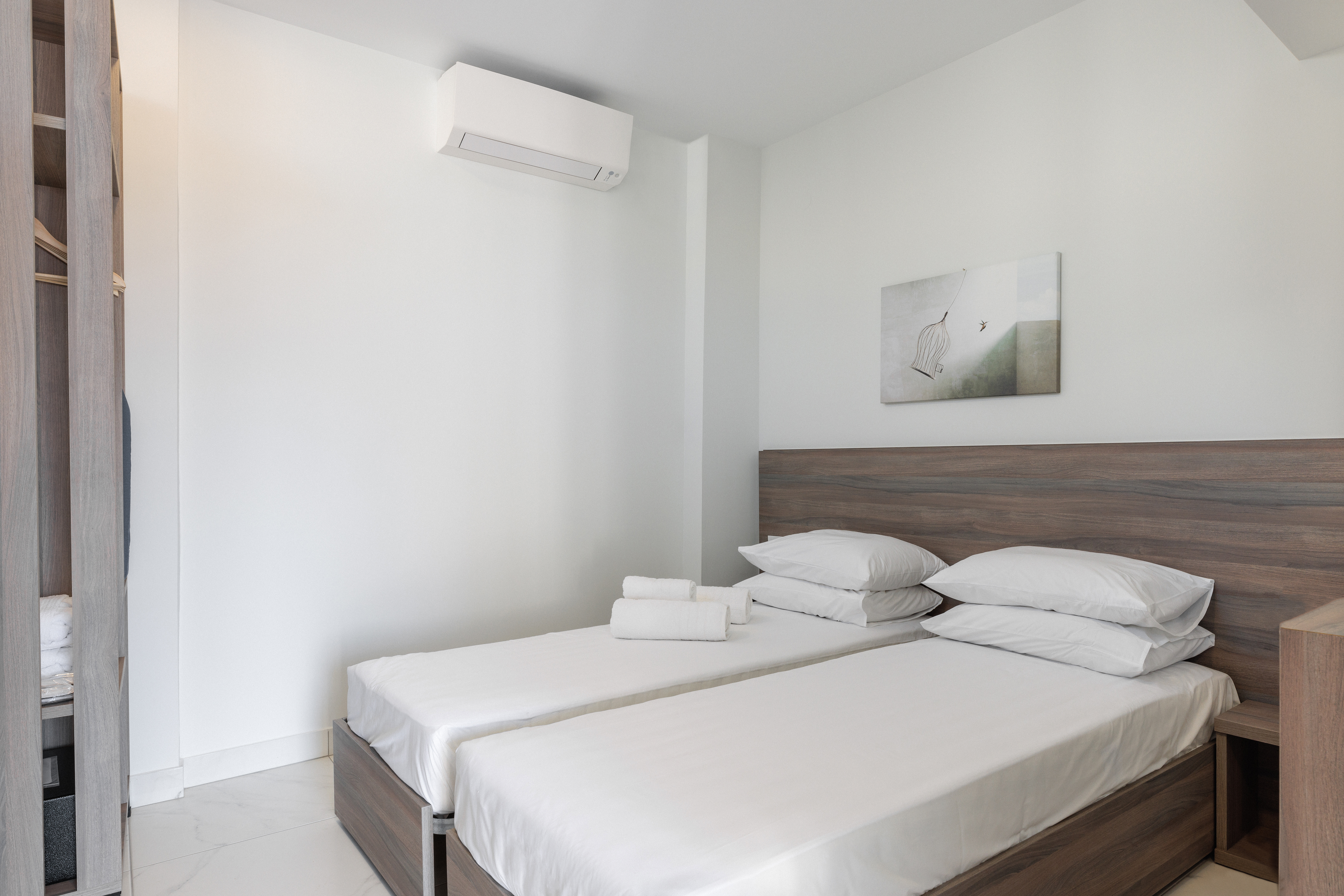a bed with white sheets