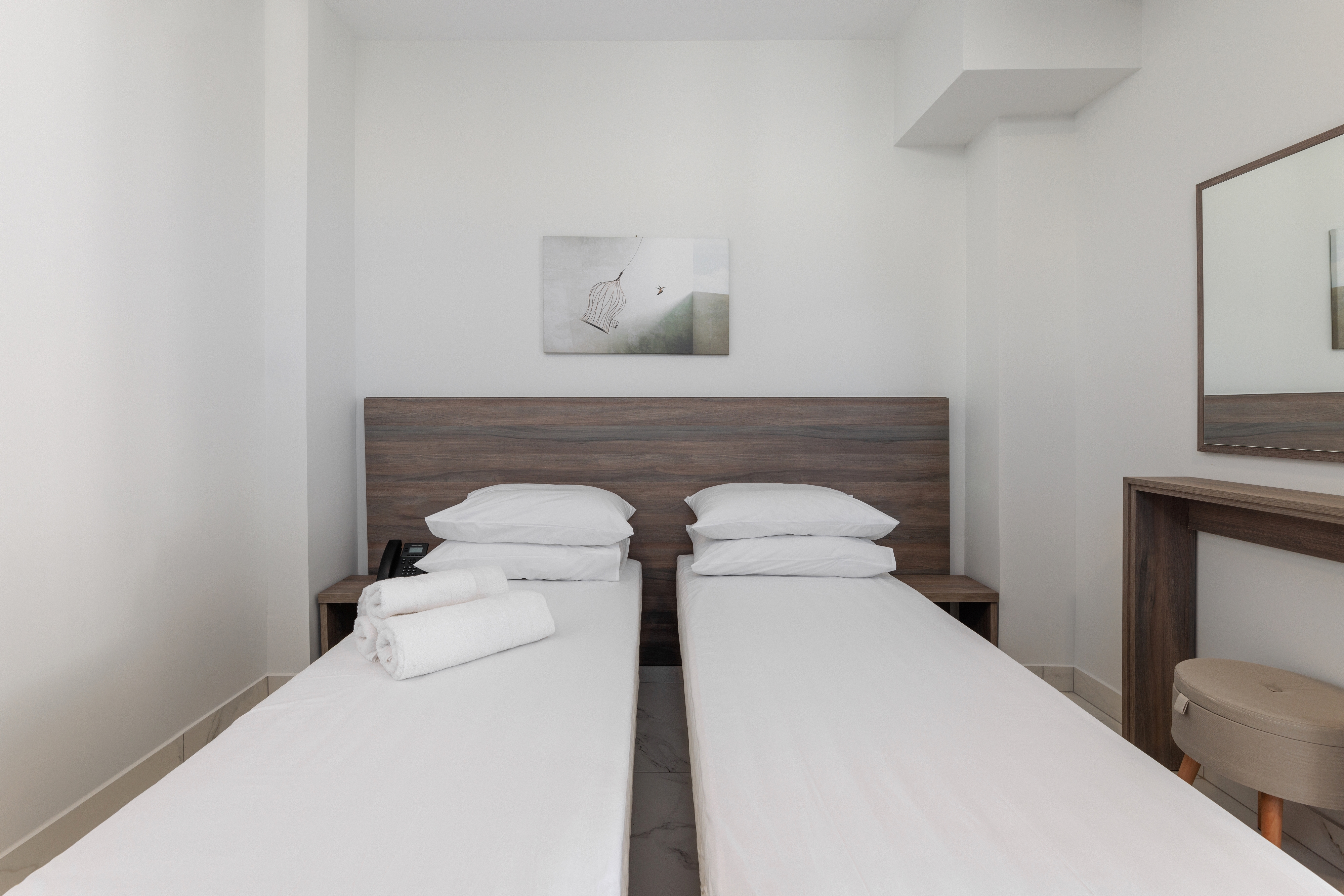 a room with white beds