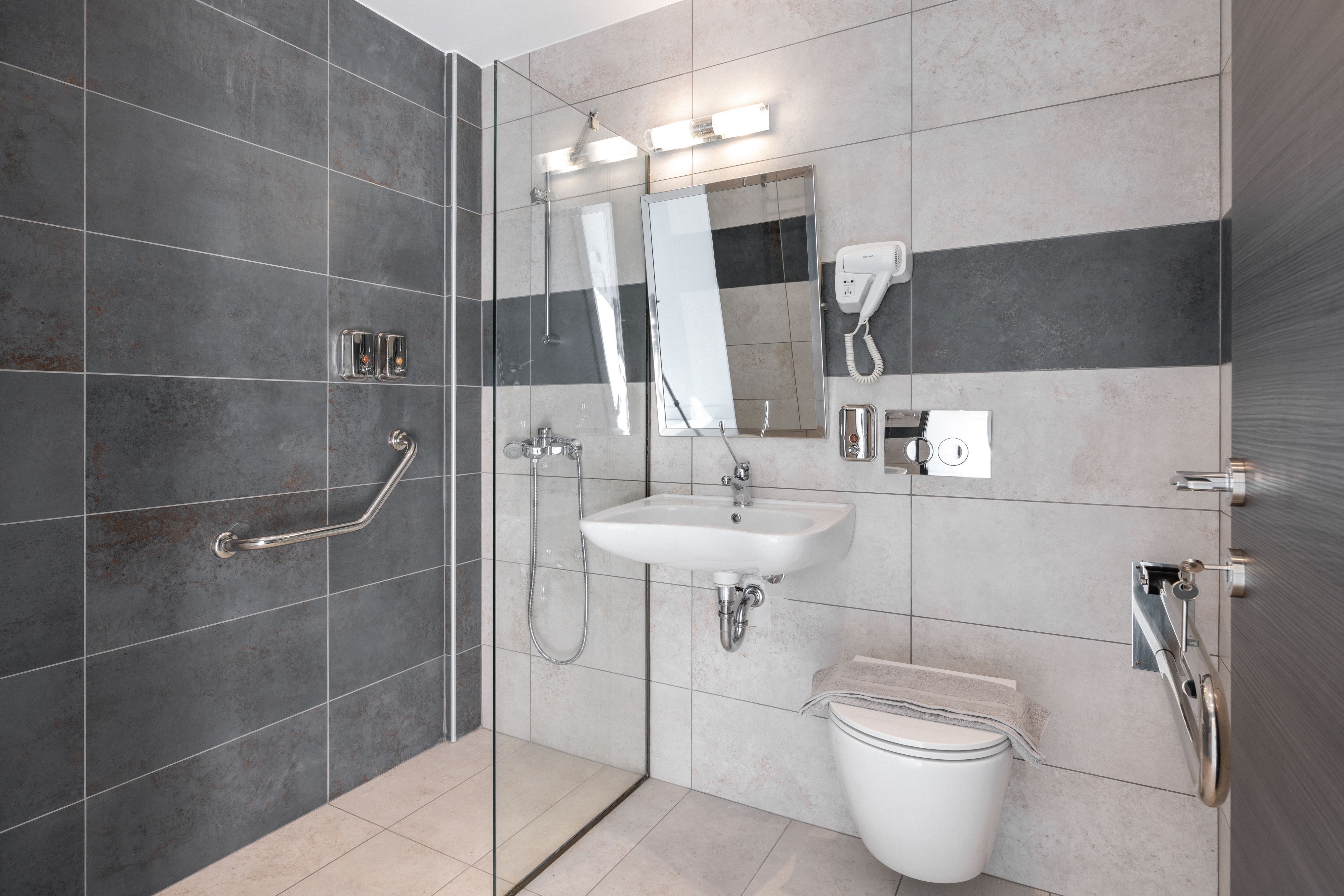 a bathroom with a sink toilet and mirror