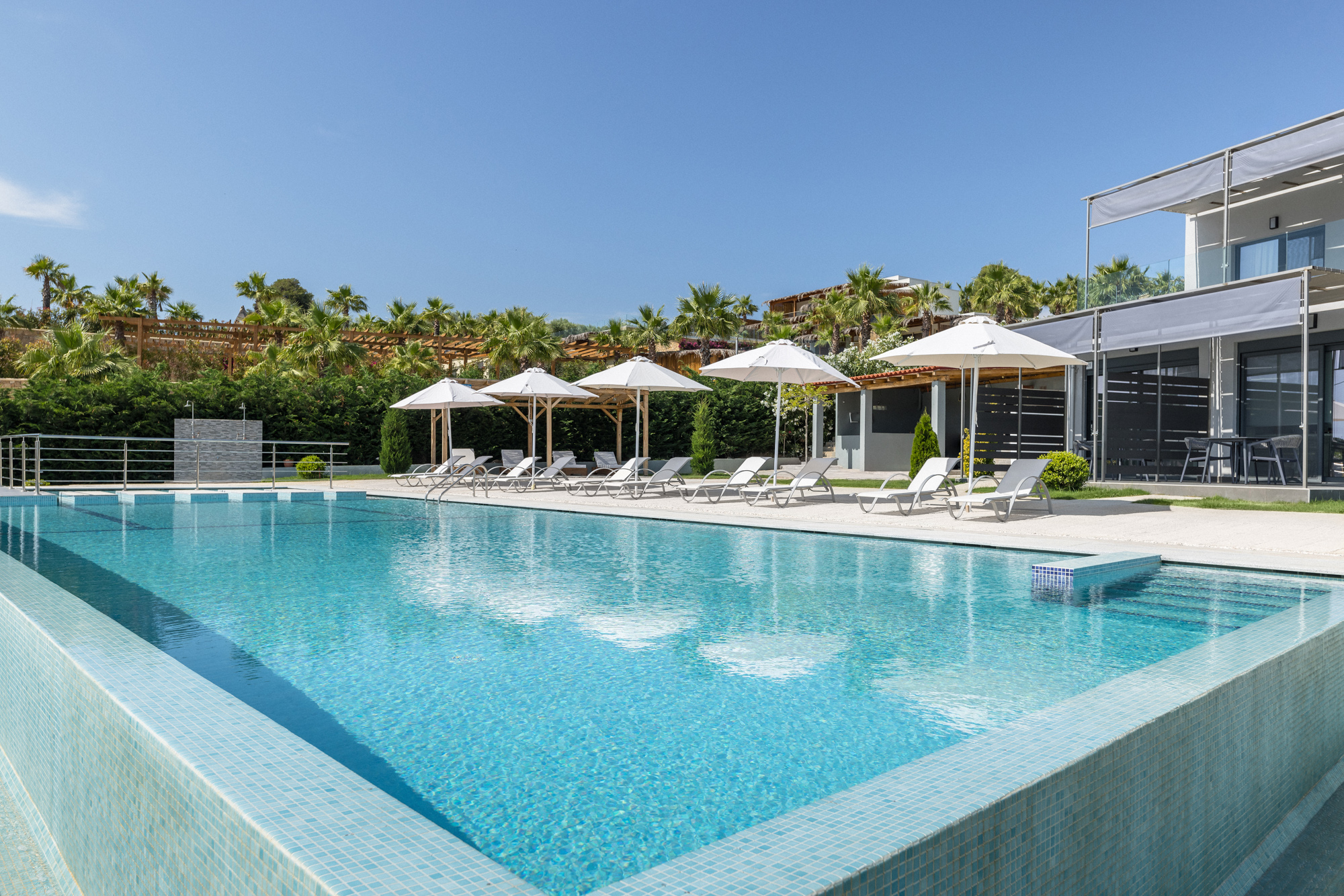 a swimming pool with umbrellas