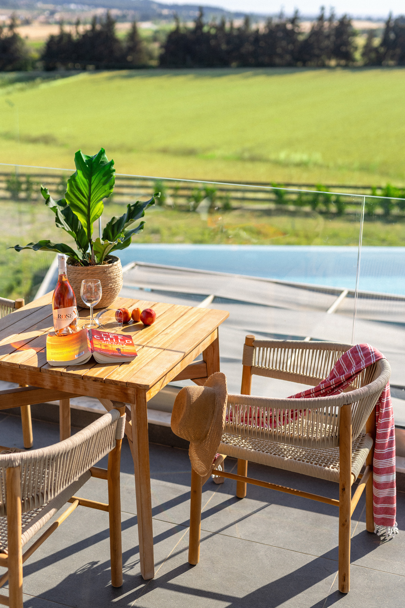 a table with chairs and a pool
